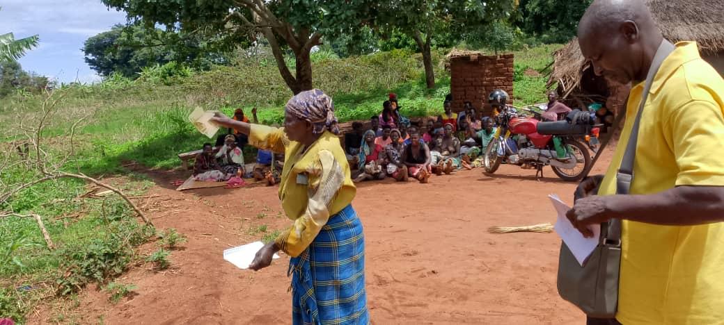 One of the Women VSLA group in Juloka Parish, Warr Town council, receive the seed capital support of shillings 200,000 from MP Songa Biyika Lawrence.Photo/ Alex Pithua