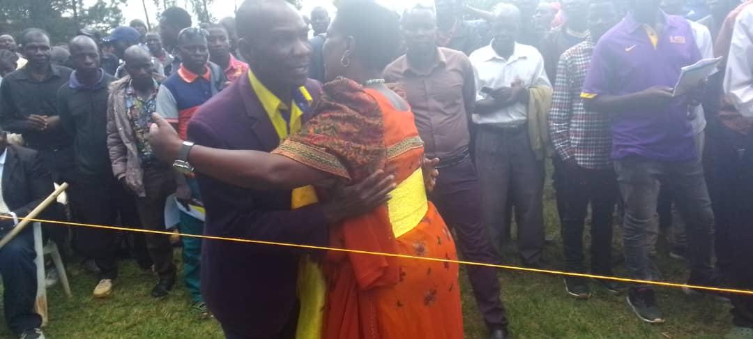 The incumbent NRM chairperson Tom Joram embrace the new NRM Party Chairperson Grace Thorach , after she was declared the winner.