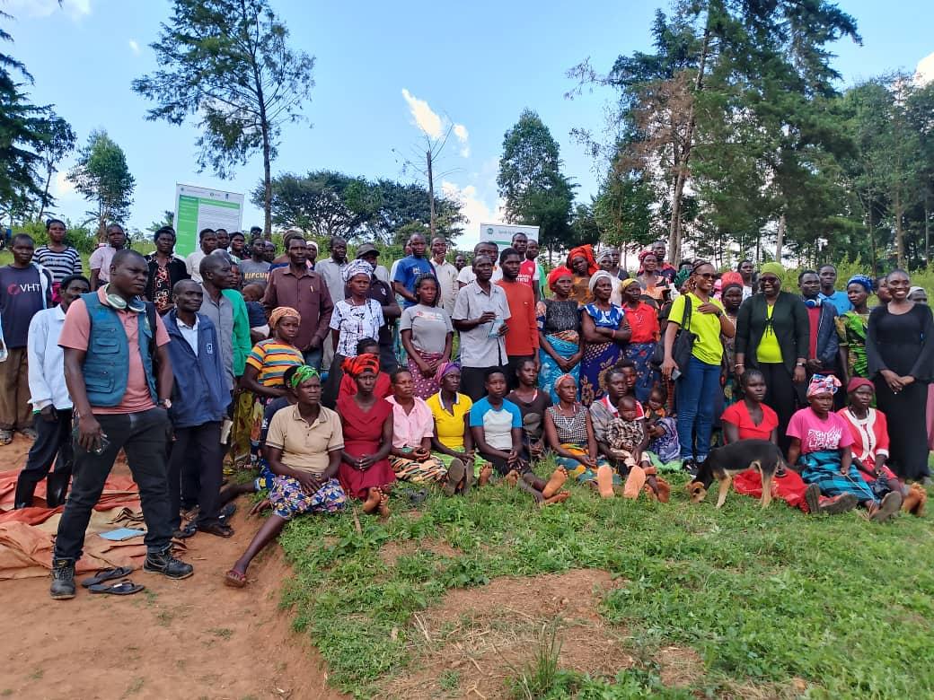 A group of farmers from Ayanyunga Micro Station, and officials from implementing  partners of the Dutch-funded "Power of Voices" project, at Ajere Village, Osoye Parish, Nyapea Sub-County, Zombo District last week . Photo by Mike Rwothomio.
