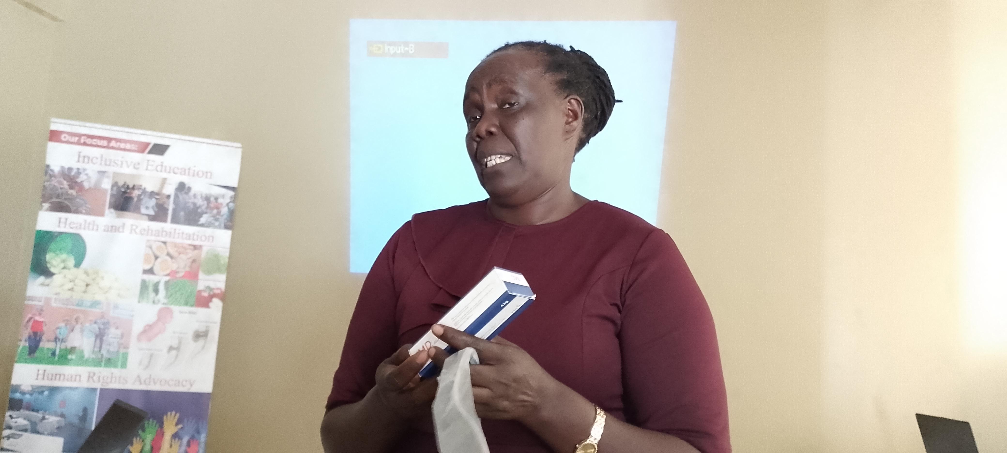 Judith Acan Okech explain to stakeholders how to manage spina Bafida and hydrosephelus. Photo Alex Pithua