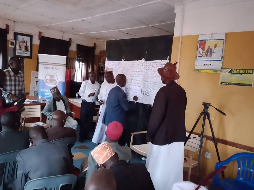 On September 30, 2025, Alur Kingdom officials, joined by the Commissioner of the Uganda AIDS Commission, posed for a photo at the Alur Kingdom Secretariat in Nebbi Municipality after endorsing key commitments.