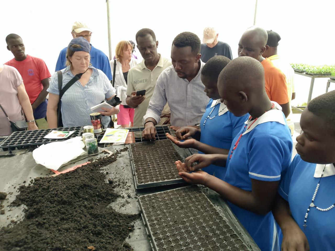 Joseph Male a trainer with spice of life teaching learners on how to plant seedlings.