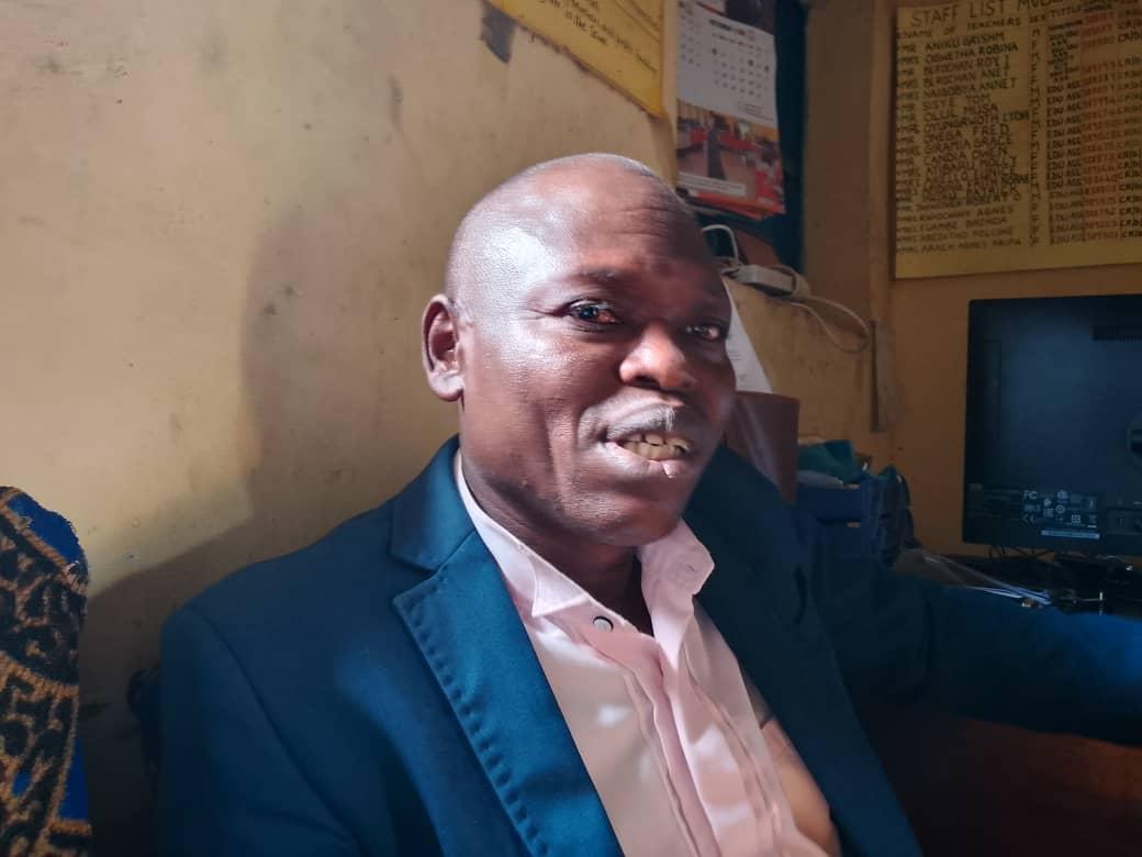 Mr. Grisim Aniku, Headteacher of Mvungu Upper Primary School, reported 154 registered candidates (106 from Mvungu Upper; 48 from Mvungu Lower), with only two absences from Mvungu Upper.
