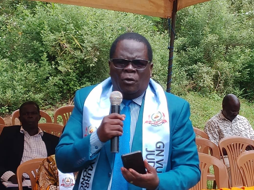 Canon Kura Vasco addresses the gathering at the anniversary