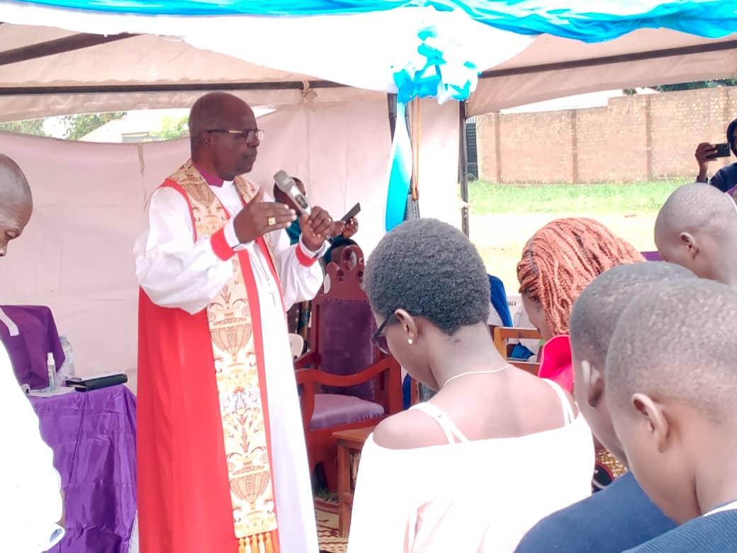 Retired Archbishop Orombi Commends Nebbi School's Stellar UCE 2025 Results By Mike Rwothomio Retired Archbishop of the Church of Uganda, Dr. Henry Luke Orombi, has commended Sunrise Secondary School in Nebbi for its outstanding performance in the 2025 Uganda Certificate of Education (UCE) examinations, describing it as a pivotal achievement that has dispelled longstanding negative perceptions about academic excellence in the Greater Nebbi area. Speaking as the school's patron during a Thanksgiving service held at the institution on Saturday, February 22, 2026, Archbishop Orombi praised the school for producing the top-performing candidate in the West Nile sub-region, Emmy Mungacel, and for securing the second position among the top 20 best-performing schools in West Nile. "You have taken away the shame on us. People used to say nothing good comes from Nebbi, you have proven them wrong," Orombi stated. "This time, you have sprinted towards success." He further expressed gratitude, noting, "I want to thank God for Sunrise because it has given us much hope." The event drew hundreds of attendees, including parents, alumni, staff, religious leaders, and local stakeholders, serving as a celebration of sustained academic growth . According to official 2025 UCE rankings from the Uganda National Examinations Board (UNEB), Sunrise Secondary School achieved a strong performance, placing second in West Nile with approximately 43% in key performance metrics , based on grade distributions, behind St. Andrews College Moyo (59%) and ahead of St. Daniel Comboni College Nebbi (42%) and Ediofe Girls SS (42%). The school's standout student which are the second cohort of Uganda's competency based curriculum is Emmy Mungacel, emerged as the best candidate across West Nile, scoring 6As, 2Bs, and 1C. Other notable performers included female students Yik Paa Rwoth Nobble (4As, 4Bs, 1C) and Jalar Aamon (3As, 5Bs, 1C). Headteacher Denis Ocaki presented a detailed analysis of the results, attributing the success to thorough preparation, strategic study habits, consistent revision, effective time management, and active engagement in classroom instruction under the competency-based curriculum. "This excellent performance puts us in a distinctive position across the region," Ocaki said. School proprietor John Ongwech emphasized the integration of moral and ethical values, such as reverence, ethical grounding, and moral integrity grounded on "fear of God" to foster motivation, resilience, and long-term succes. Stakeholders credited the school's rise as a regional academic leader to multi-stakeholder collaboration, including robust school governance, dedicated teaching staff, active parental involvement, and learner-centered approaches. The 2025 UCE results, released by UNEB on February 13, 2026, reflect broader national gains under the competency-based system, with a record 99.69% pass rate (428,628 candidates qualifying for the certificate) and a sharp decline in failure rates to 0.31% from 1.9% in 2024. Students reacts Mungacel Emmy attributed his success to hard work, moral grounding, and strong teacher coordination, urging peers to emulate the same dedication. Fellow top performers Yik Paa Rwoth Nobble and Jalar Aamon highlighted the invaluable support from teachers and parents. Established in 2007, Sunrise Secondary School has consistently produced top-performing students in the UCE examinations. However, because the school previously offered only O-Level, many of these high-achieving students had to transfer to other schools to pursue their Advanced Level studies. This year, the school is pleased to announce the opening of its A-Level section thus allowing students to complete their Advanced Certificate of Education at the School. Headteacher Ocaki stated, “We have finally opened the A-Level section for our learners. For too long, we have produced some of the best-performing students only to see them join other schools. This change ensures our talented students can continue their education in a familiar and supportive environment without being ‘wasted’ elsewhere.” Located just 1km along the Nebbi-Pakwach Road in Nyangam Upper Cell, Nyarwodhu Ward, Thatha Division, Nebbi Municipality, Sunrise Secondary School, a private institution, has over the years shown consistent improvement through collaborative efforts among leadership, staff, learners, and the community.