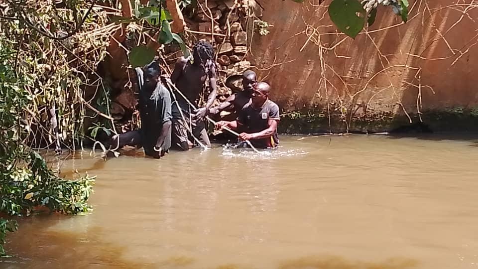 Local divers retrieving the body of a one Joshua, the taxi conductor.
