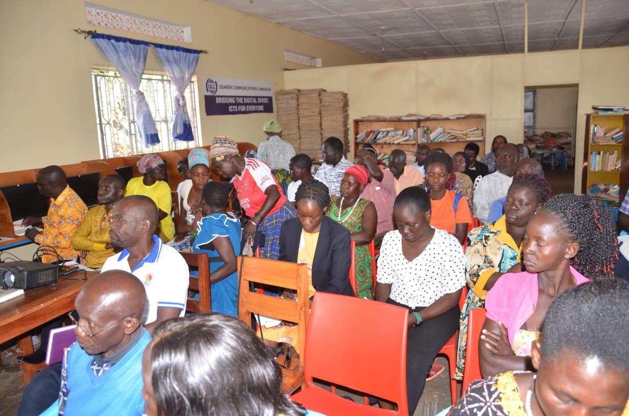 Stakeholders from Paidha town council for orientation meeting with officials from ministry of Gender at Paidha town council Library.