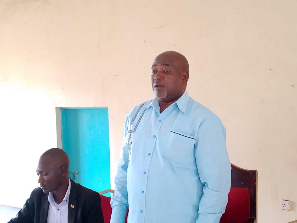 Mr. Everest Tumwesigye, Commissioner for Community Development and Literacy at the Ministry of Gender, Labour and Social Development addressess the gathering during the site handover.