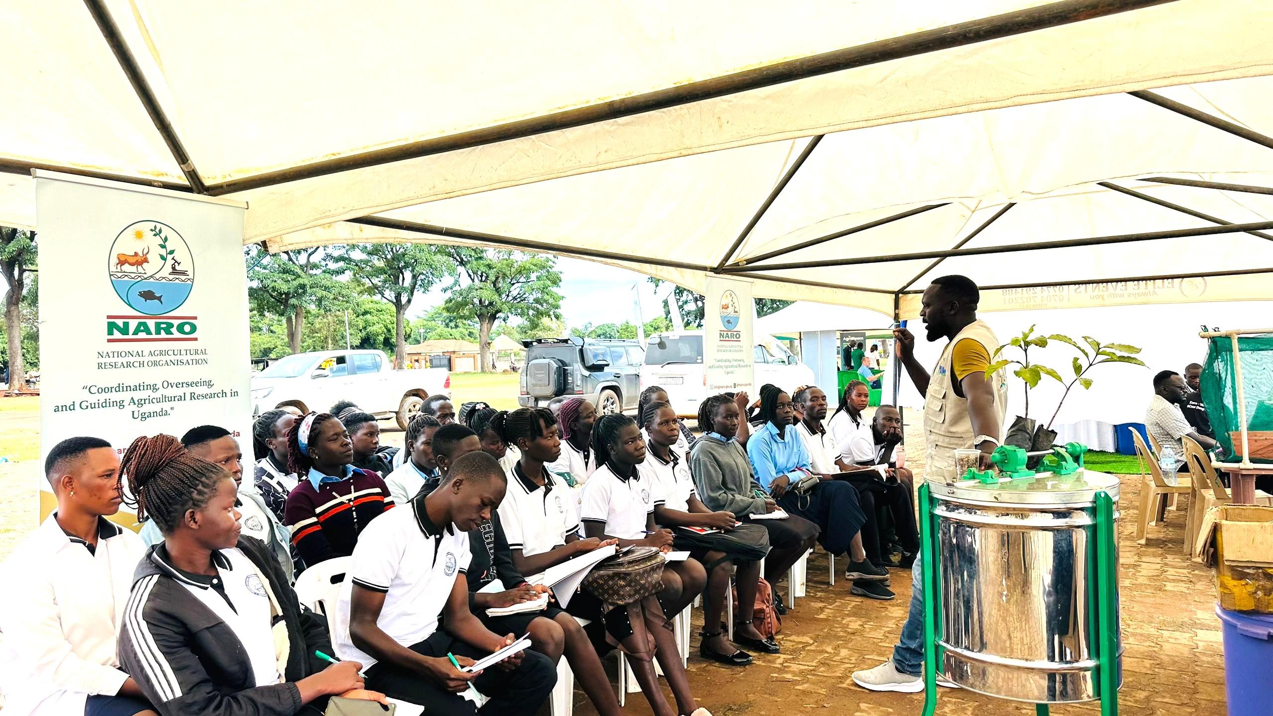 Showgoers looking at some of the improved seed varieties. Photo by Alex Pithua