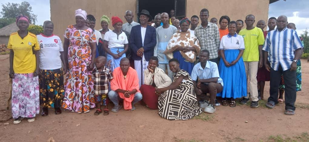 Alur Kingdom Prime Minister Prince Lawrence Opar Angala posed for a photo with believers after he fund raising event.