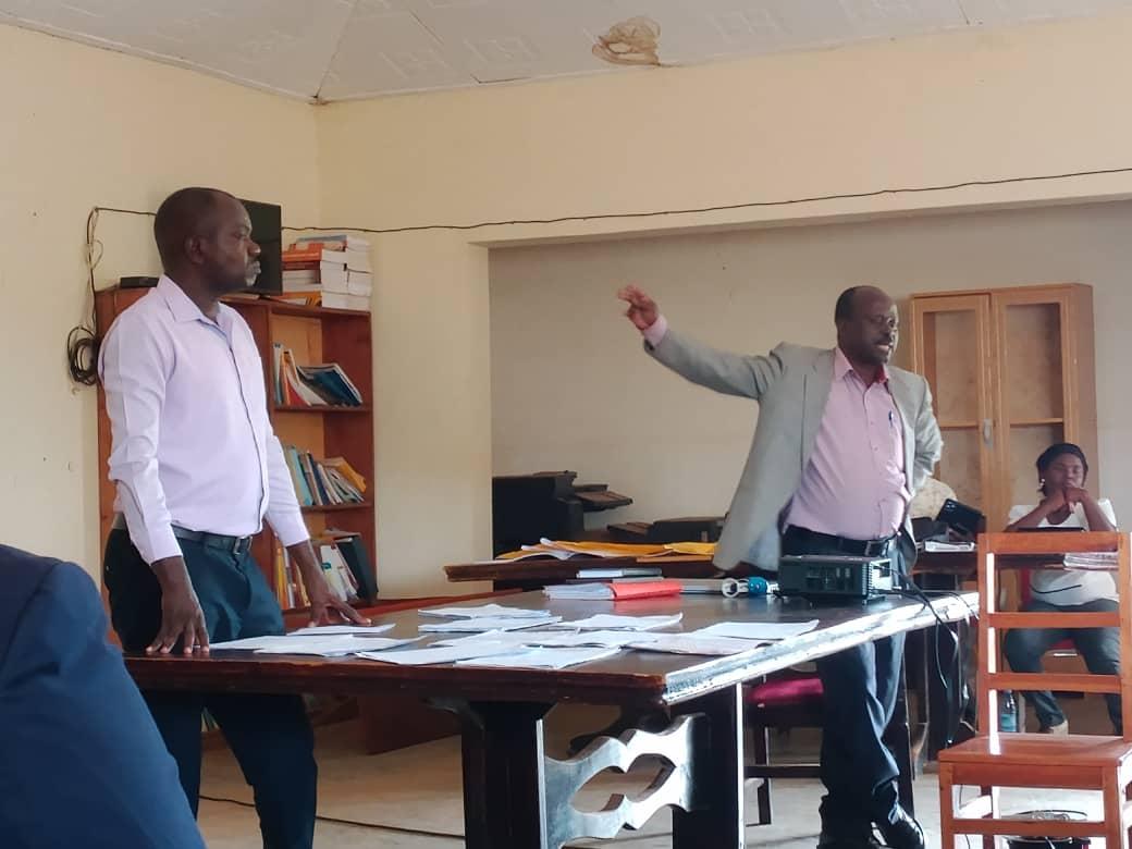Dr. Walter Kumakech (L), District Production Officer, and Mr. Lamet Olum (R) address stakeholders at the district headquarters during a report on the implementation of the Parish Development Model (PDM) on March 31, 2025.