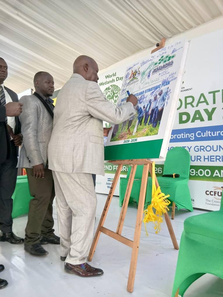 PRIME MINISTER OF THE ALUR KINGDOM LAWRENCE OPAR ANGALA SIGNS A WETLAND CONSERVATION PLEDGE DURING WORLD WETLANDS DAY 2026 CELEBRATIONS IN KAMPALA.