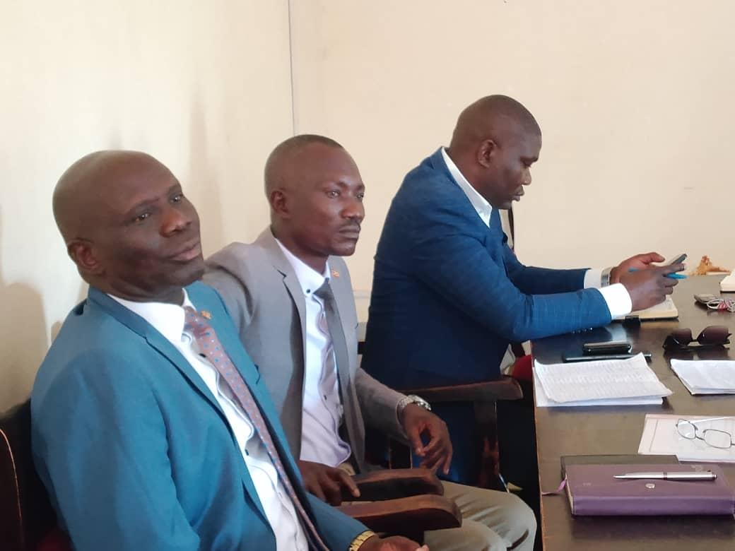 The District Security Committee members, led by the Resident District Commissioner (RDC) Festus Ayikobua, at the meeting.