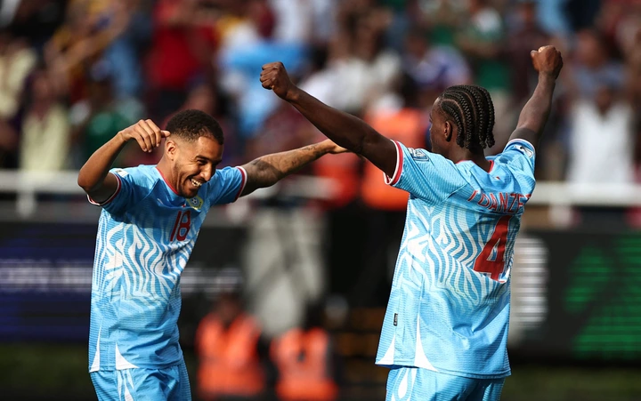 DR Congo’s midfielder #18 Charles Pickel and defender #04 Axel Tuanzebe celebrate after winning the match and qualifying for the World Cup during the 2026 FIFA World Cup qualifiers final playoff football match between the Democratic Republic of the Congo and Jamaica at the Akron Stadium in Zapopan, Jalisco state, Mexico, on March 31, 2026. (Photo by Ulises Ruiz / AFP)