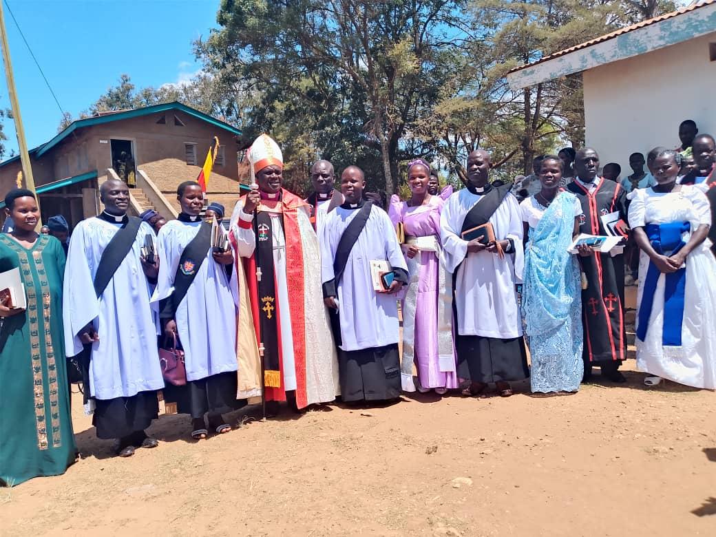 Newly ordained priests pose for a group photo with the Bishop of Nebbi, Rev. Pons Ozelle, at St. Stephen's Cathedral, Goli, on Sunday.