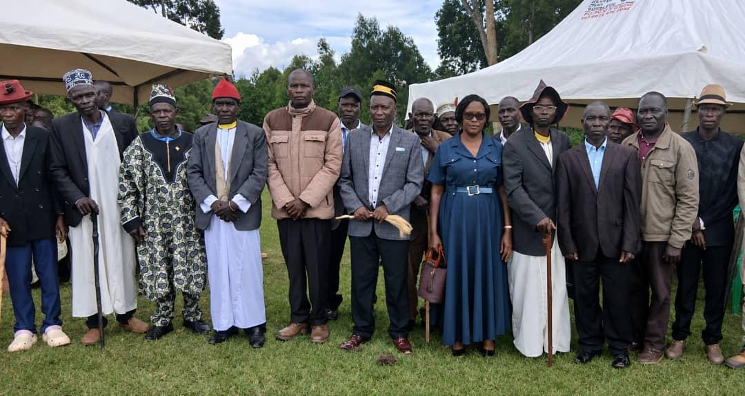 Prime Minister (Jadipu) Prince Lawrence Opar Angala poses for a group photo with a cross section of Ker Alur chiefs from Zombo District led by their chairman Rwoth Evaristo Kerunega Rini 1V of Avari Chiefdom (4th right) and Hon John Wapokra (3rd right) Ministry of Lands and Production; Hon Juliet Umika Oromcan (5th right) and Director of Youth and Sports Kumakech soon after the Requiem Mass before burial of the late Natalina Oweci, mother to Hon James Oruna Oyulu, Chairman of Zombo District at Pakadha Primary School playground in Abanga Subcounty, Zombo District on 11th May 2025.