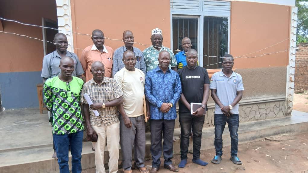 Alur Kingdom Prime Minister ( Jadipu) Prince Lawrence Opar Angala (standing centre in blue shirt) poses for a group photo with this year's Cultural Enthronement Executive Committee members led by the Chairman of Atyak Royal Council, John Uluba (3rd left) soon after the inaugural preparatory meeting at his office in Yamo Trading Centre, Zombo District.