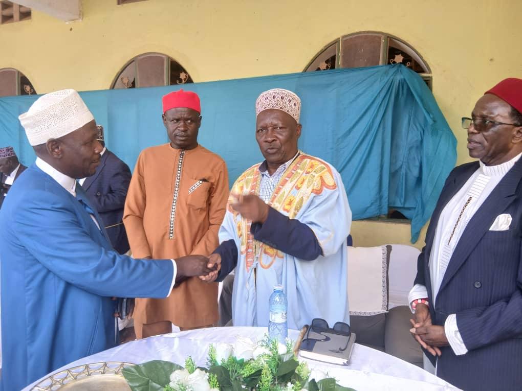 Alur Kingdom Prime Minister Prince Lawrence Opar Angala ( Right) greets Sheikh Ssali Imran, Secretary for Religious Affairs at the Uganda Muslim Supreme Council (UMSC) left after the function.