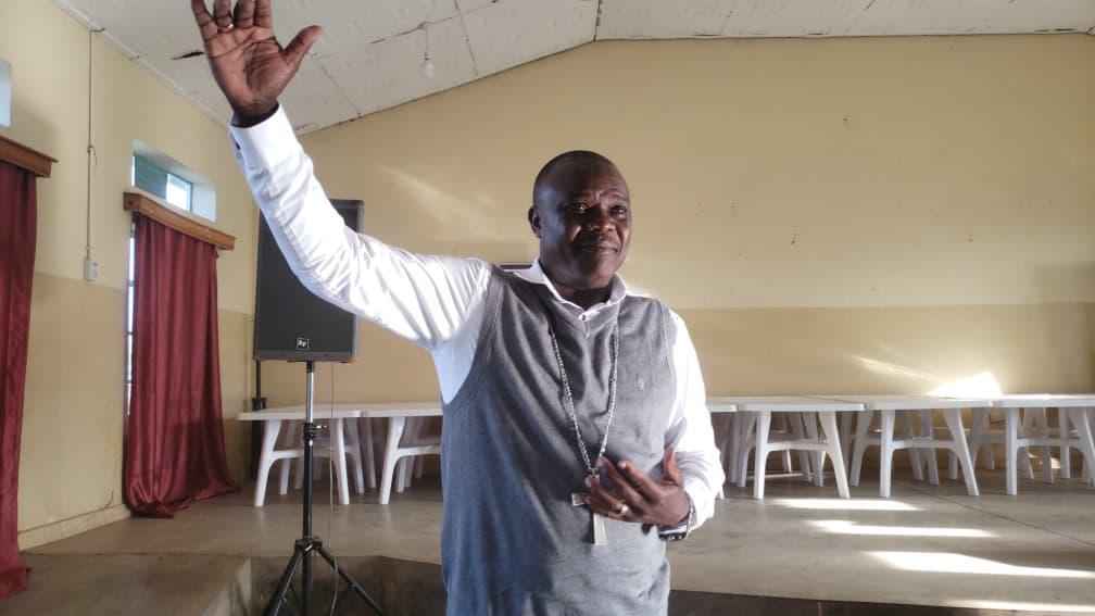 Bishop Pons Ozelle Awinju addresses the gathering