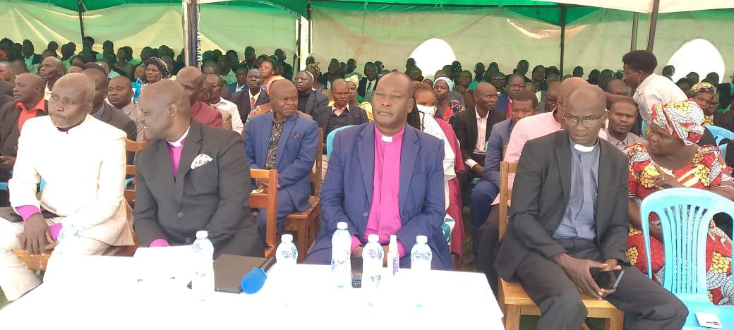 General Overseer Bishop Bagoza Charles preaching gospel to thousands of mourners during the burial of late Bishop John Okethwengu at Adhingi primary school in Zombo district. (Photo by Alex Pithua)
