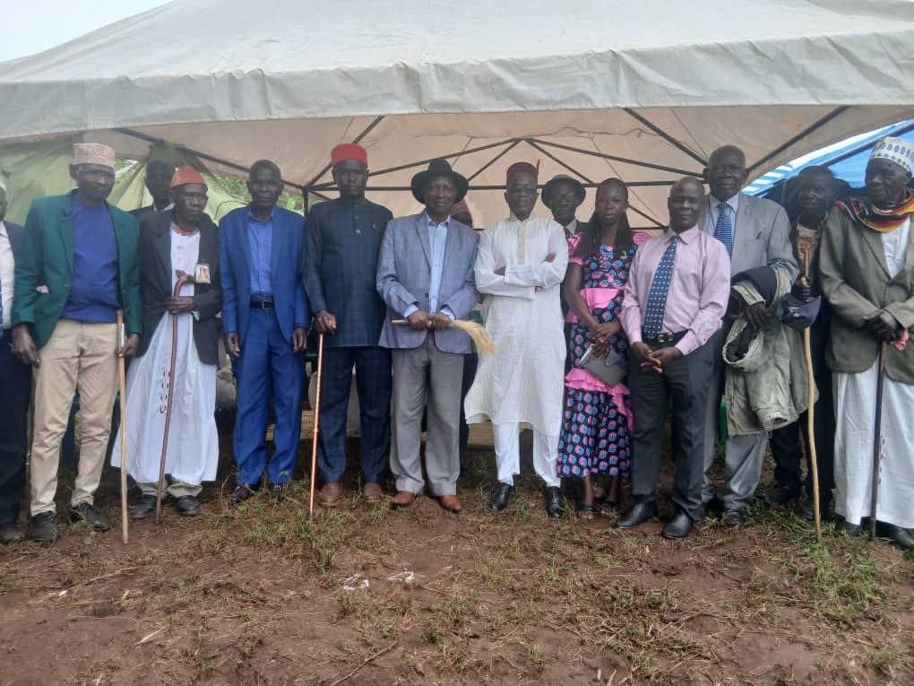 Jadipu (Prime Minister) Prince Lawrence Opar Angala (left) posed for a photo with Rev Father Moses Okwenuru after the Thanksgiving Ceremony.