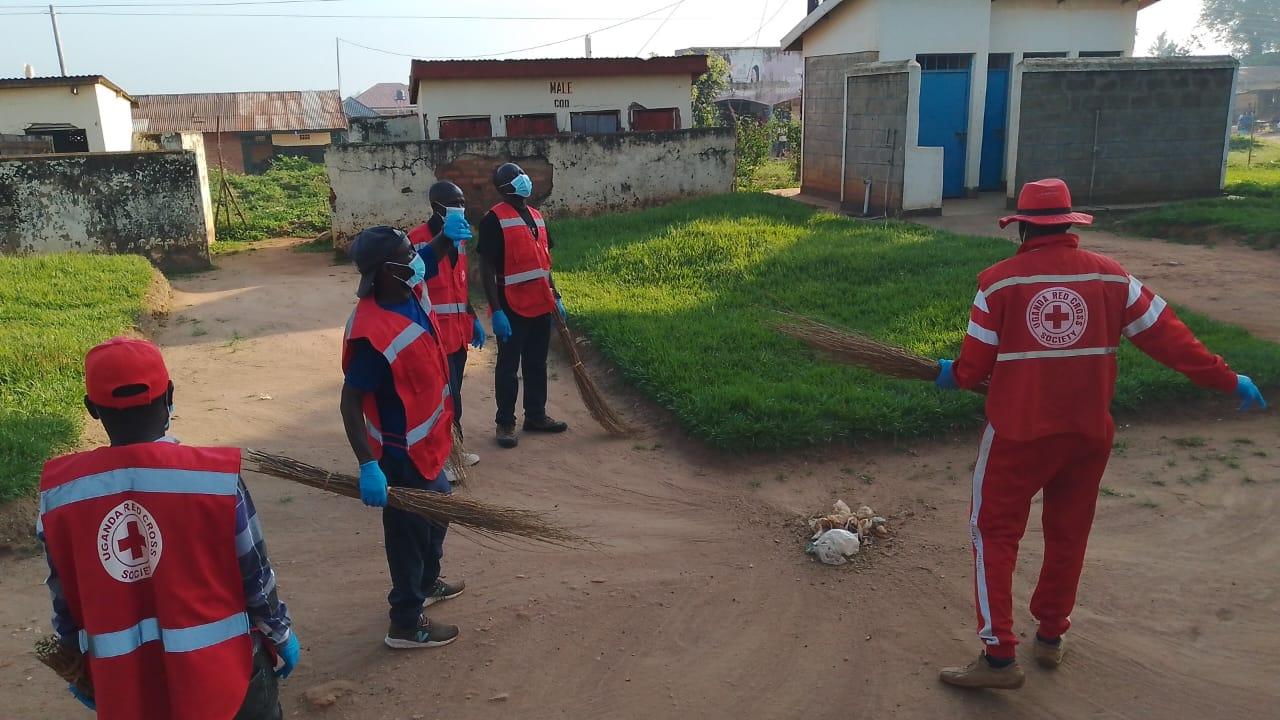 A team from Uganda Red Cross Society Zombo link cleans Paidha Health Center III on Saturday morning.