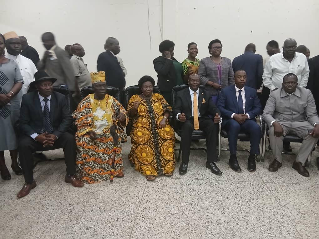 Prime Minister (Jadipu) Prince Lawrence Opar Angala (seated extreme left) who represented the Ubimu HRM Phillip Olarker Rauni III poses for group photo with the chief guest/ Minister of Health for Primary Health Care and stakeholders from all districts of West Nile at the MoH conference on the statuses of ebola and other diseases in the sub-region held on Thursday 20th August 2026 at Muni University in Arua City.