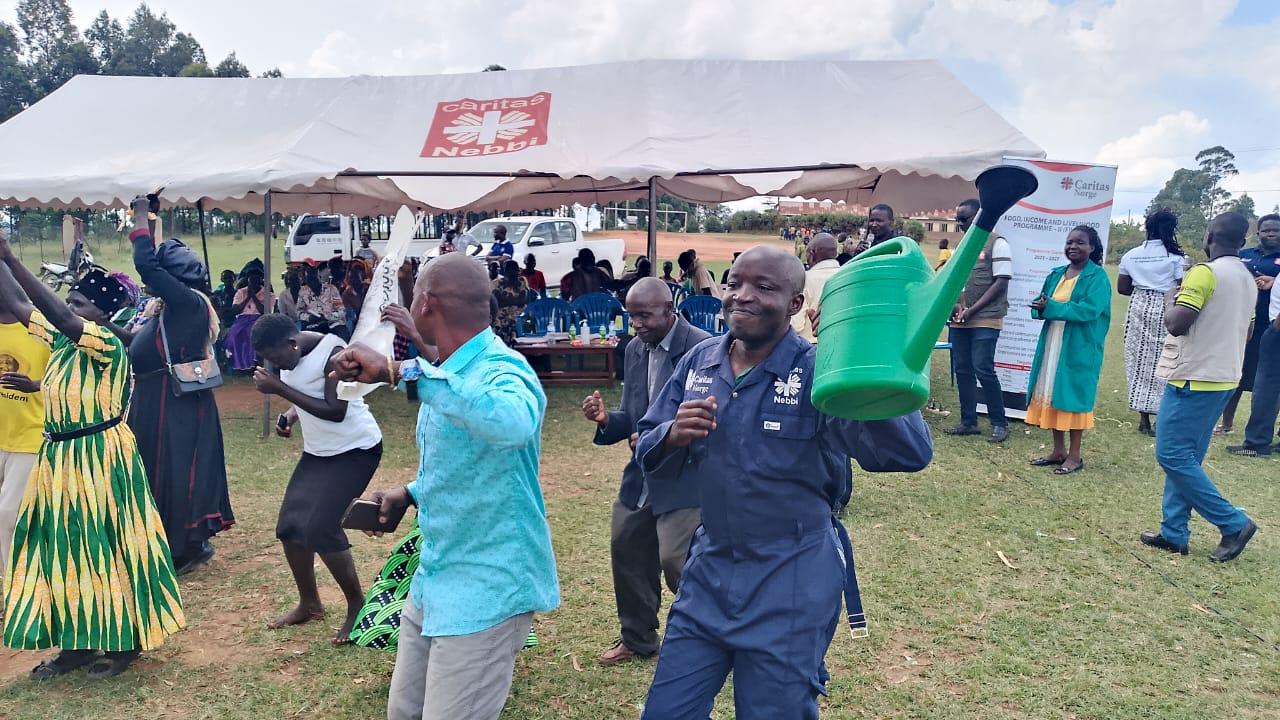 Moureen Wilembe interacts with farmers during the farmers day.