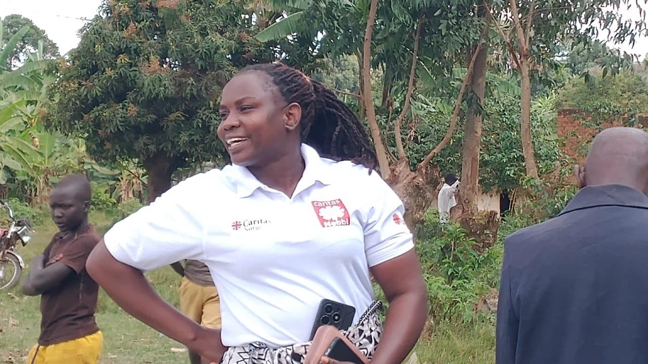 Moureen Wilembe interacts with farmers during the farmers day.