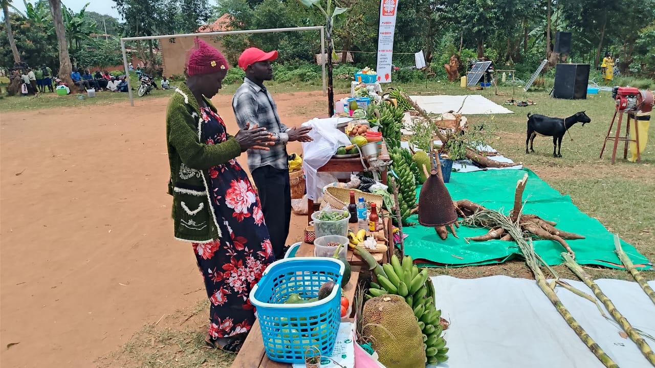 Moureen Wilembe interacts with farmers during the farmers day.