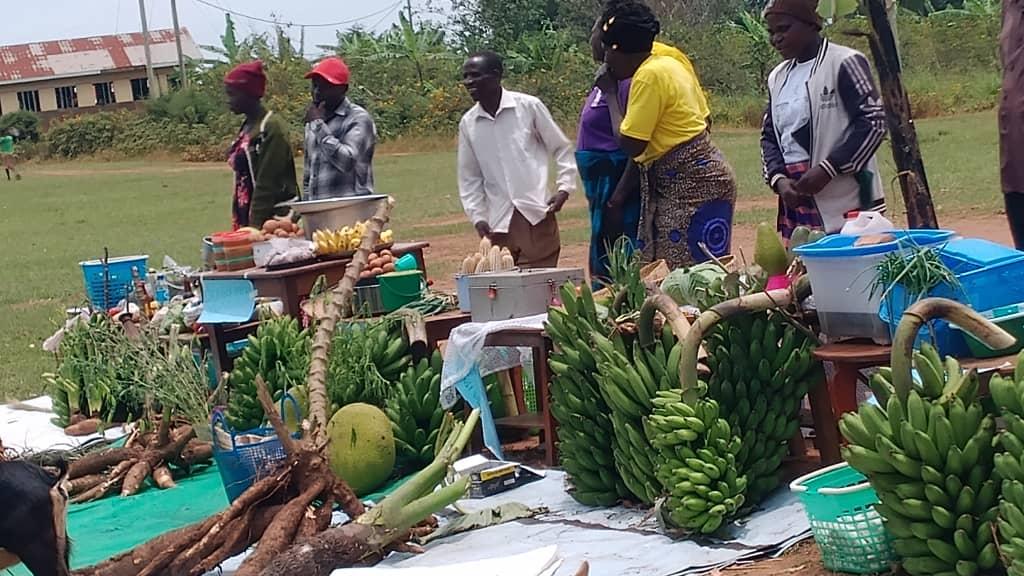 Moureen Wilembe interacts with farmers during the farmers day.